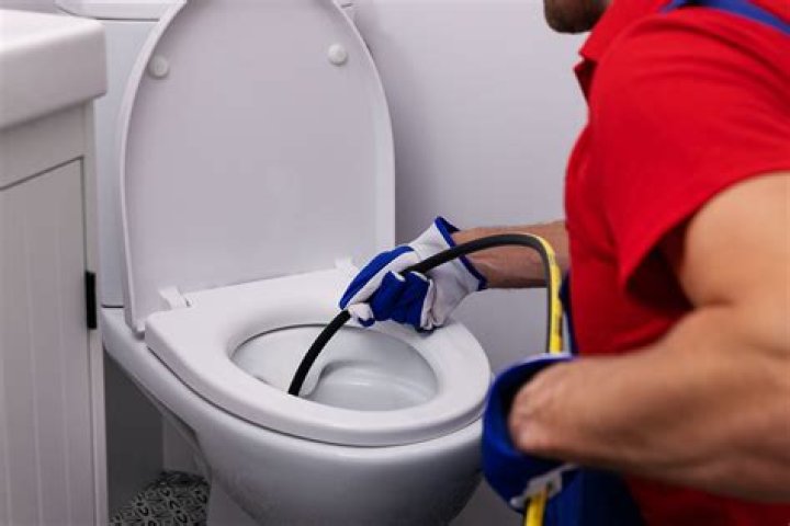 How do you unclog a marine head?